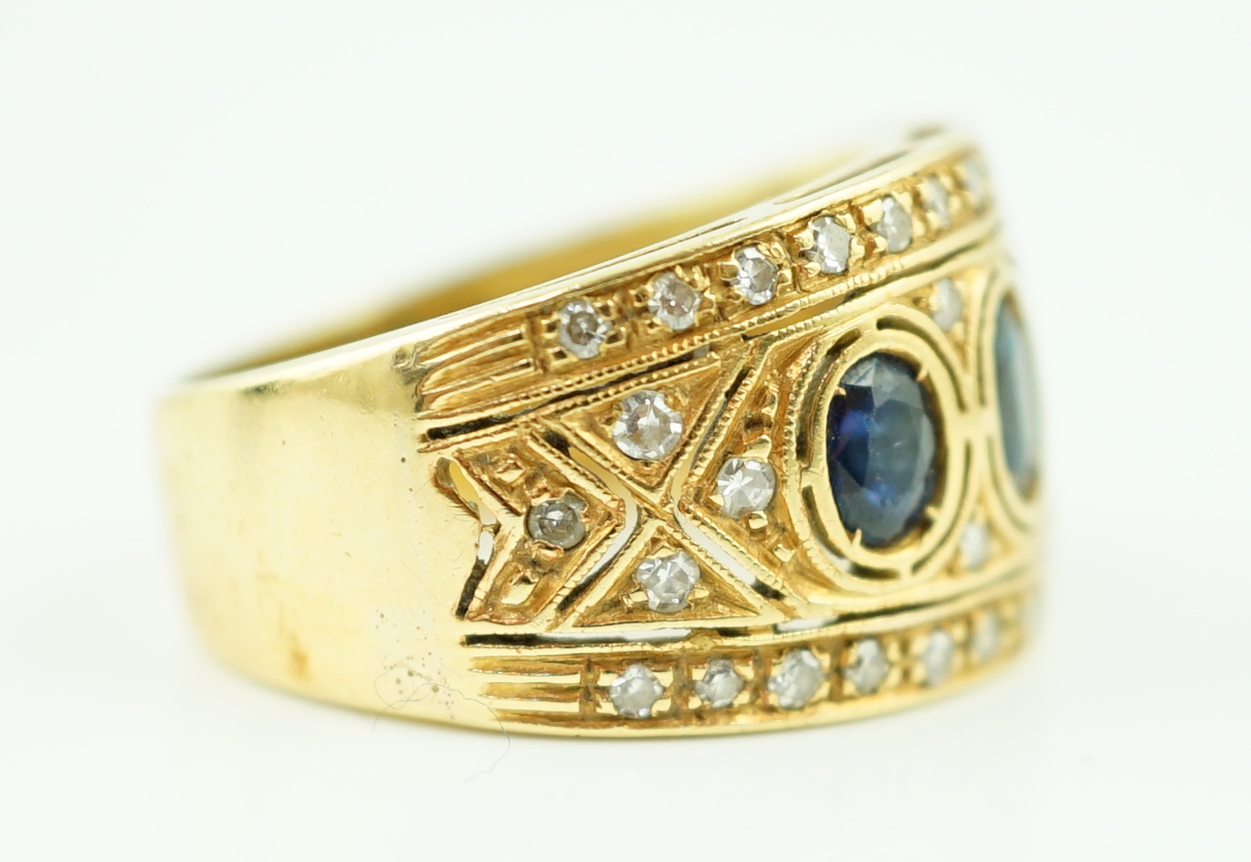 An Italian Byzantine style 18k gold, sapphire and diamond cluster ring